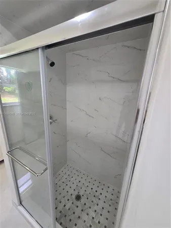 a bathroom with a toilet a sink and a mirror