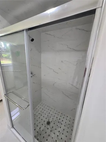 a bathroom with a toilet a sink and a mirror