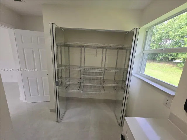 a view of a hallway with workspace