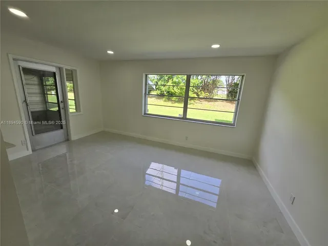 a kitchen with metallic refrigerator freezer and a dishwasher