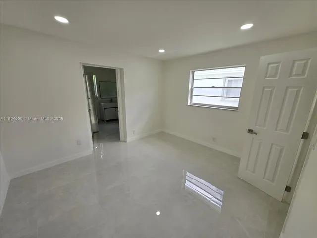 a bathroom with a tub and a shower