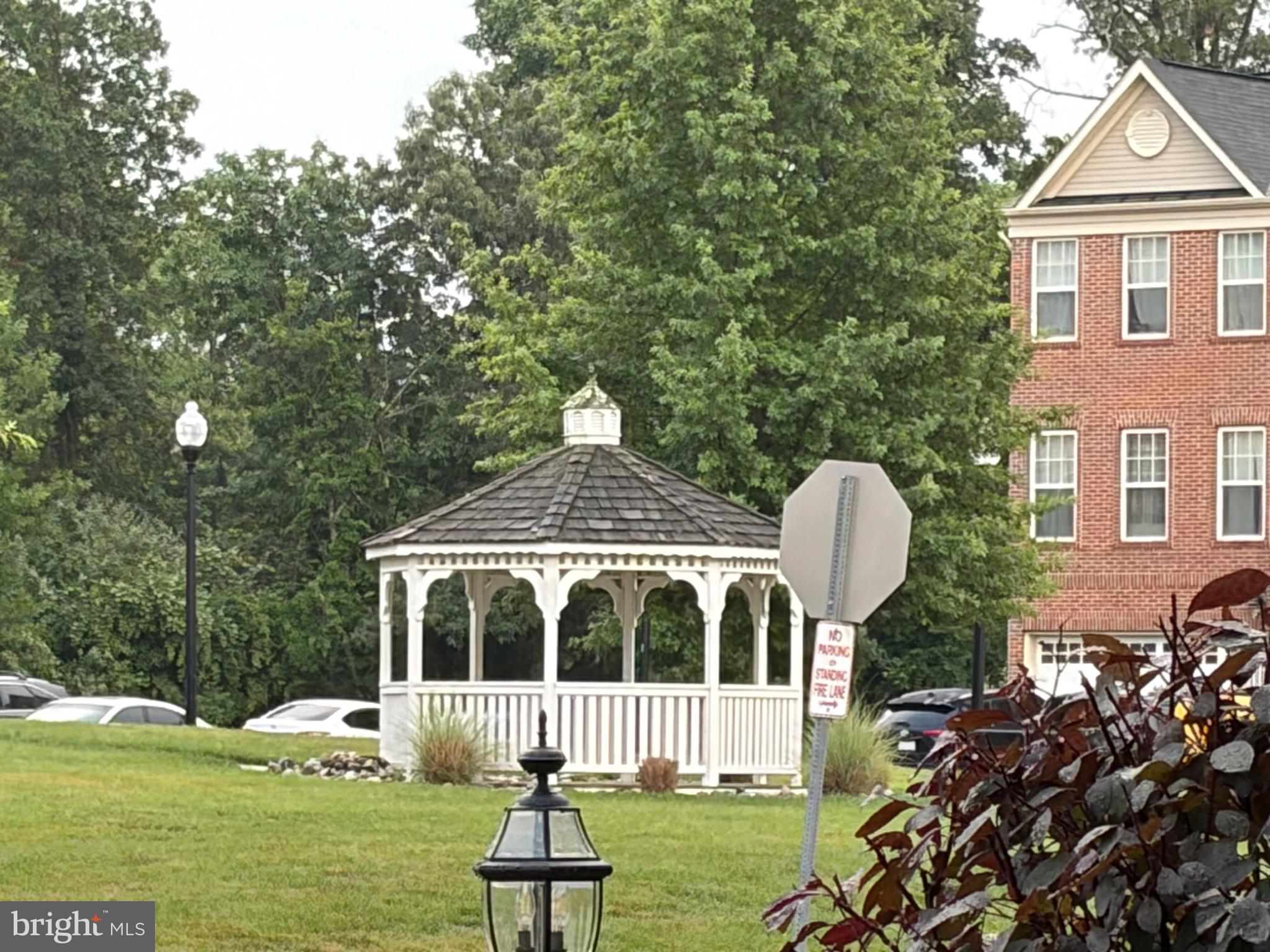25333 Wakestone Terrace Chantilly, VA 20152 - Photo 6 of 109 Charming gazebo amidst lush greenery.
