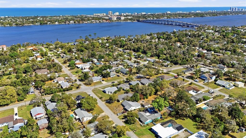 231 North Ridgewood Avenue Ormond Beach, FL 32174 - Photo 51 of 52 view of a lake with houses