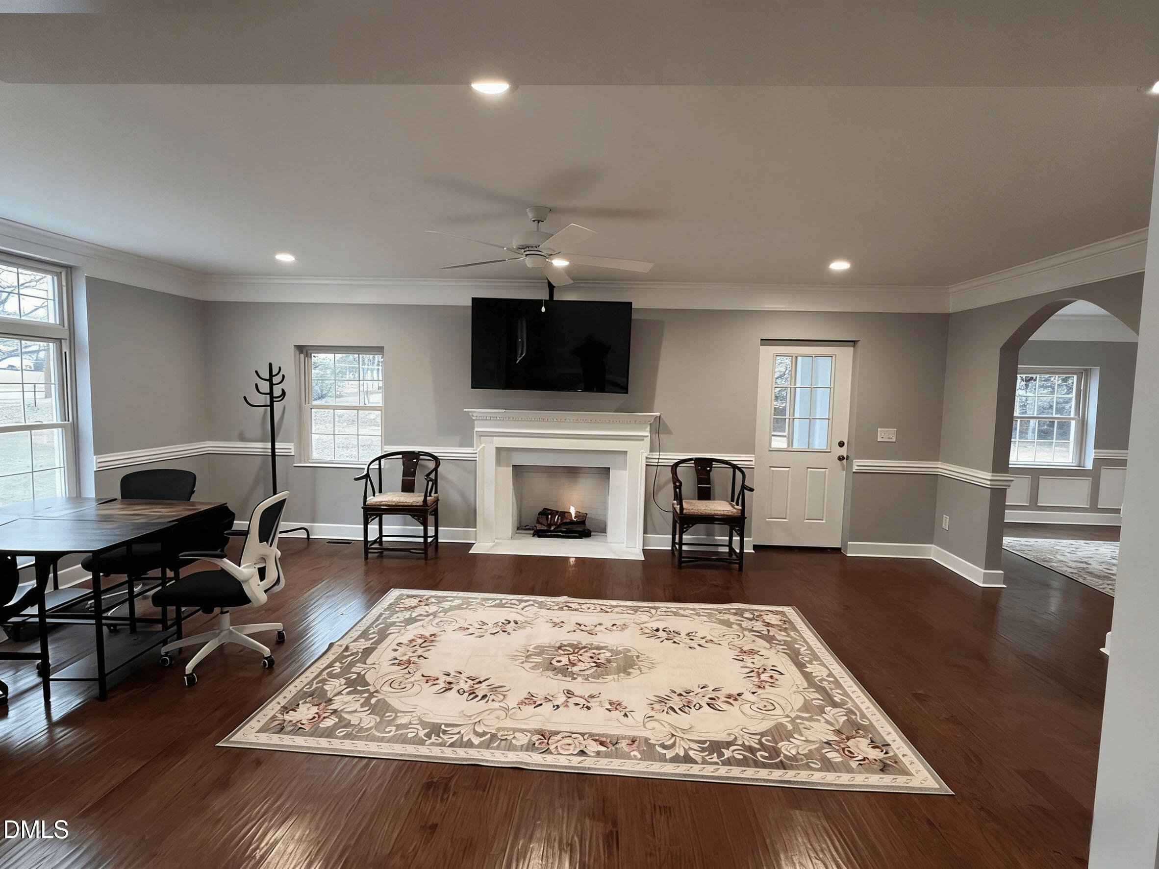 409 Rockingham Street Carthage, NC 28327 - Photo 24 of 56 a living room with furniture a fireplace and a flat screen tv