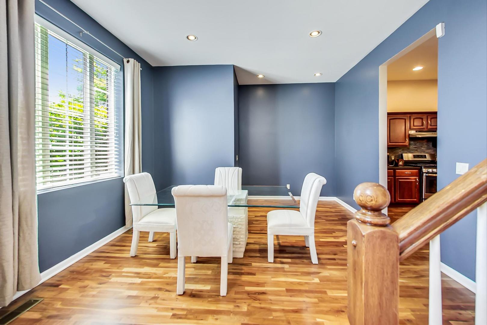 2101 Bull Ridge Drive McHenry, IL 60050 - Photo 11 of 83 a dining room with furniture and wooden floor