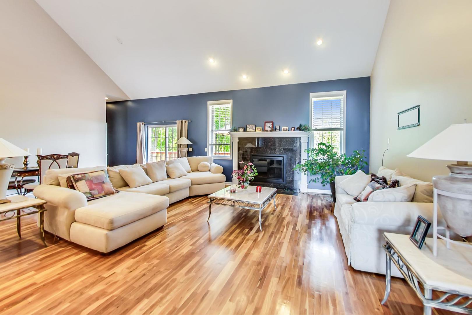 2101 Bull Ridge Drive McHenry, IL 60050 - Photo 20 of 83 a living room with furniture fireplace and a table