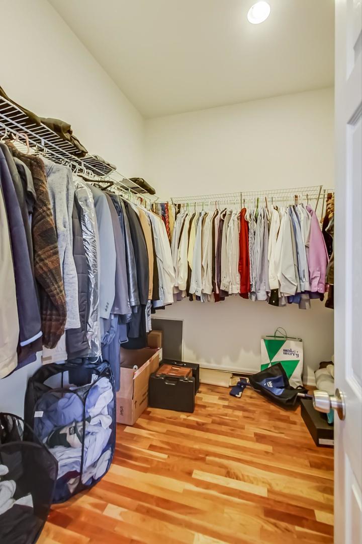 2101 Bull Ridge Drive McHenry, IL 60050 - Photo 28 of 83 a view of walk in closet with clothes and shoes