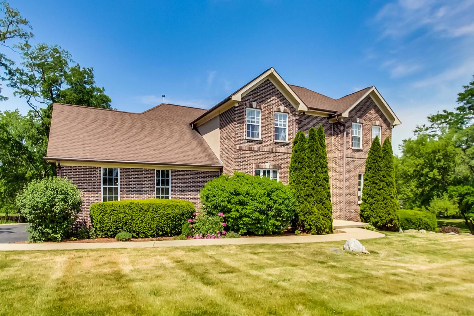2101 Bull Ridge Drive McHenry, IL 60050 - Photo 3 of 83 a front view of a house with a yard