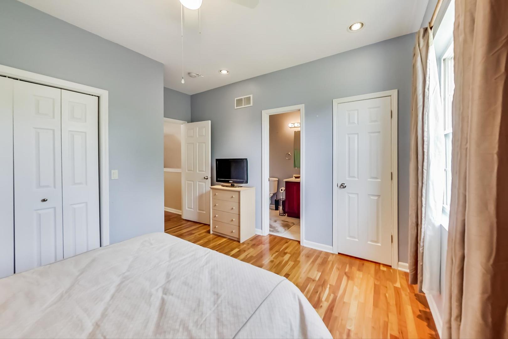 2101 Bull Ridge Drive McHenry, IL 60050 - Photo 37 of 83 a bedroom with a bed and a flat screen tv