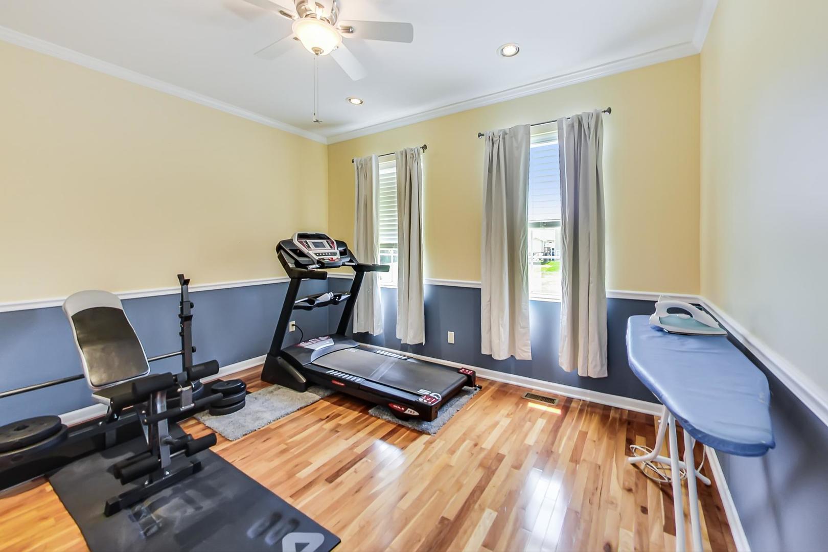 2101 Bull Ridge Drive McHenry, IL 60050 - Photo 39 of 83 a room with gym equipment and windows