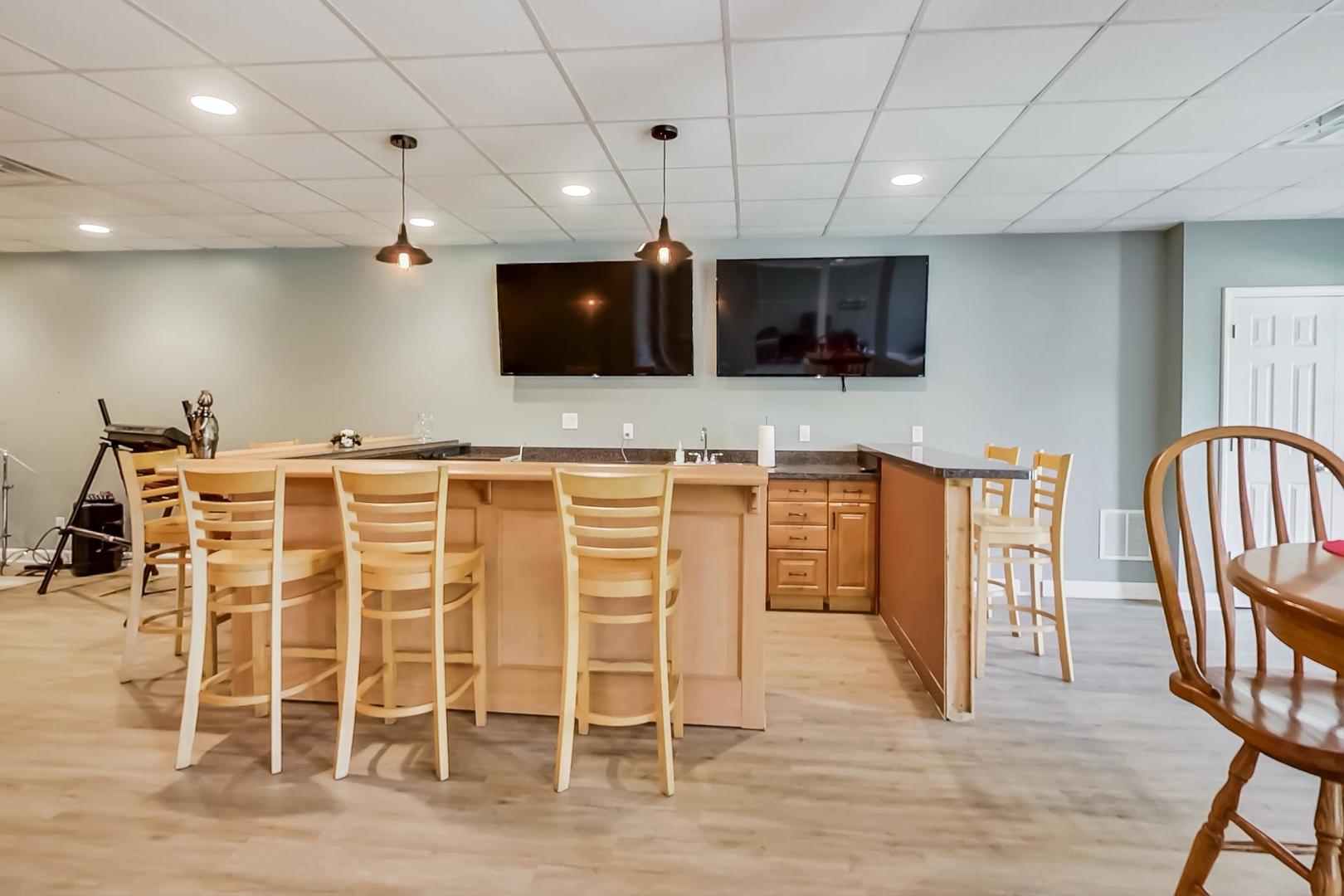 2101 Bull Ridge Drive McHenry, IL 60050 - Photo 52 of 83 a kitchen with stainless steel appliances kitchen island granite countertop a dining table chairs and granite counter tops