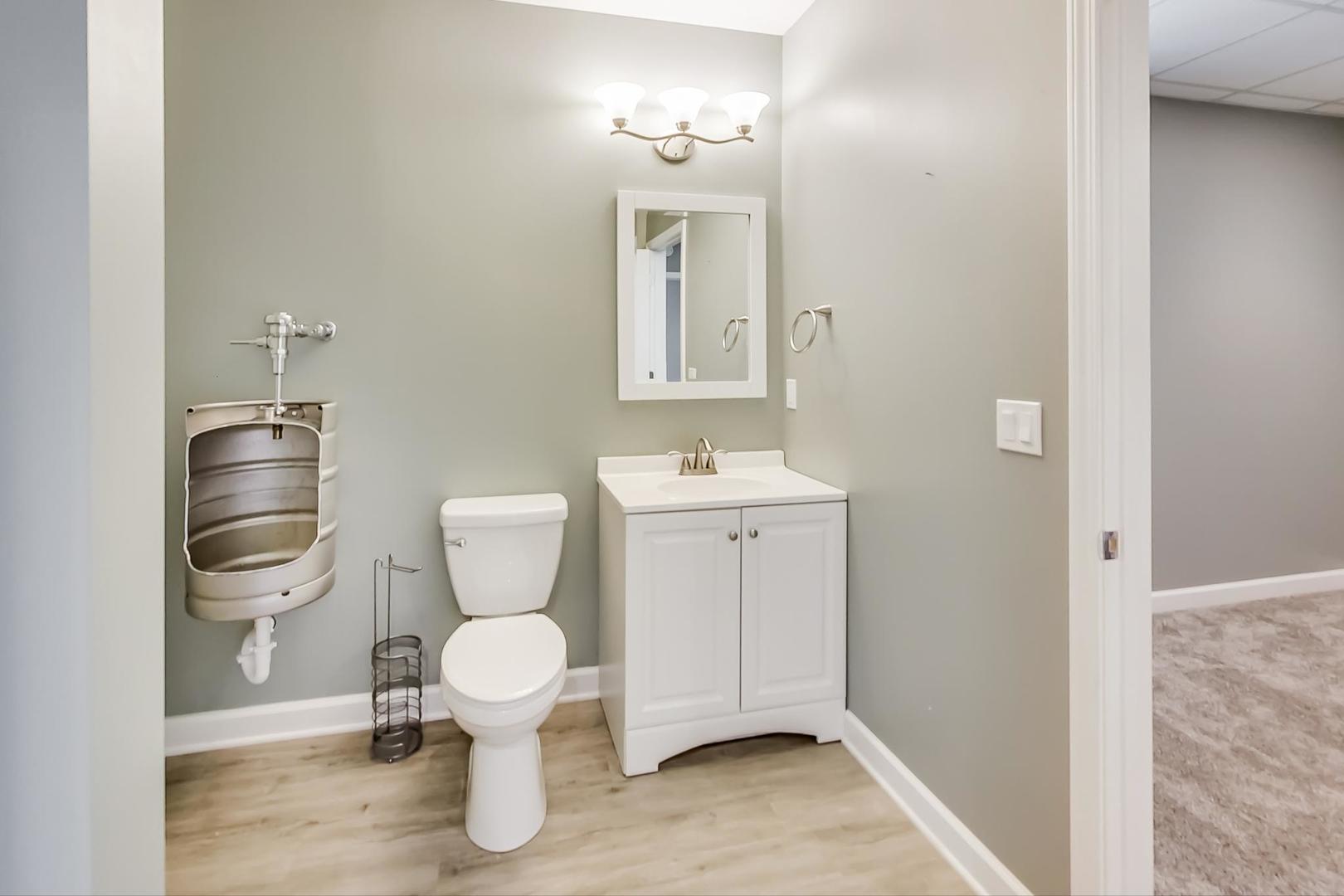 2101 Bull Ridge Drive McHenry, IL 60050 - Photo 57 of 83 a bathroom with a toilet sink and a mirror