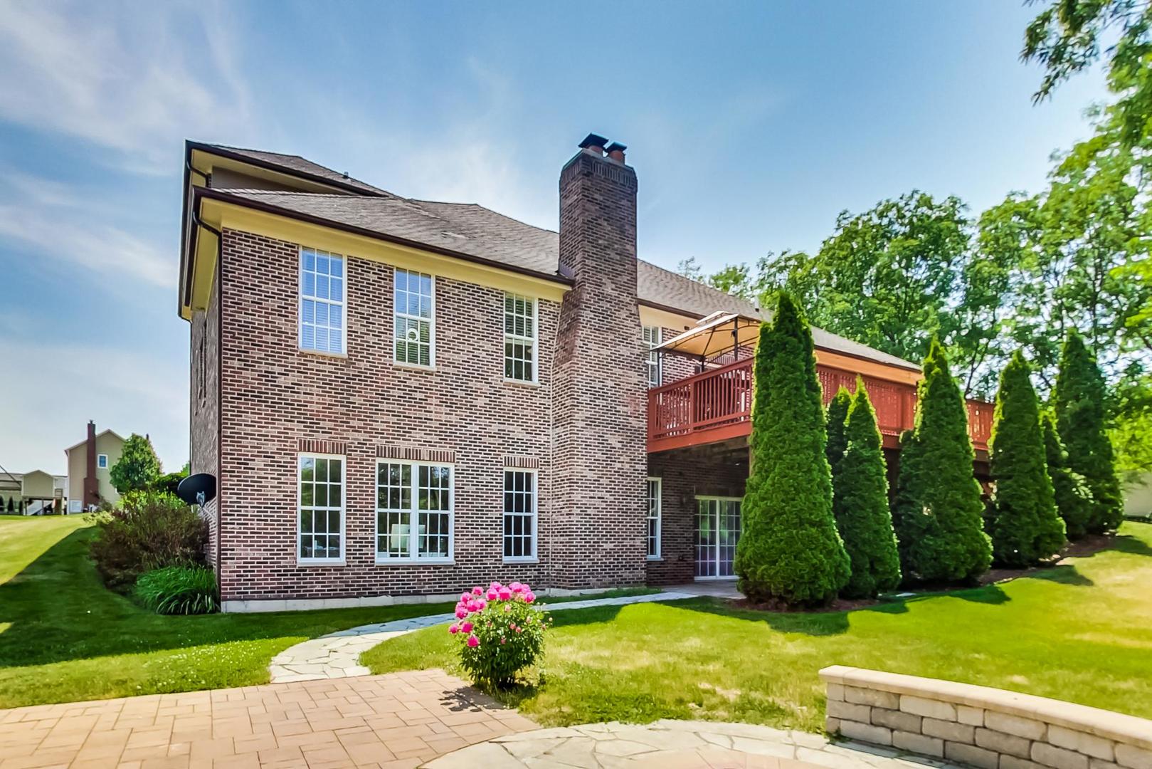 2101 Bull Ridge Drive McHenry, IL 60050 - Photo 66 of 83 a front view of a house with a yard and garage
