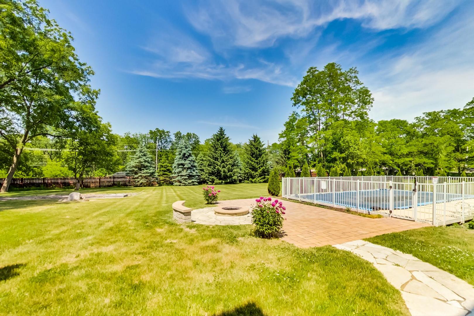 2101 Bull Ridge Drive McHenry, IL 60050 - Photo 72 of 83 a swimming pool with an outdoor space and seating area