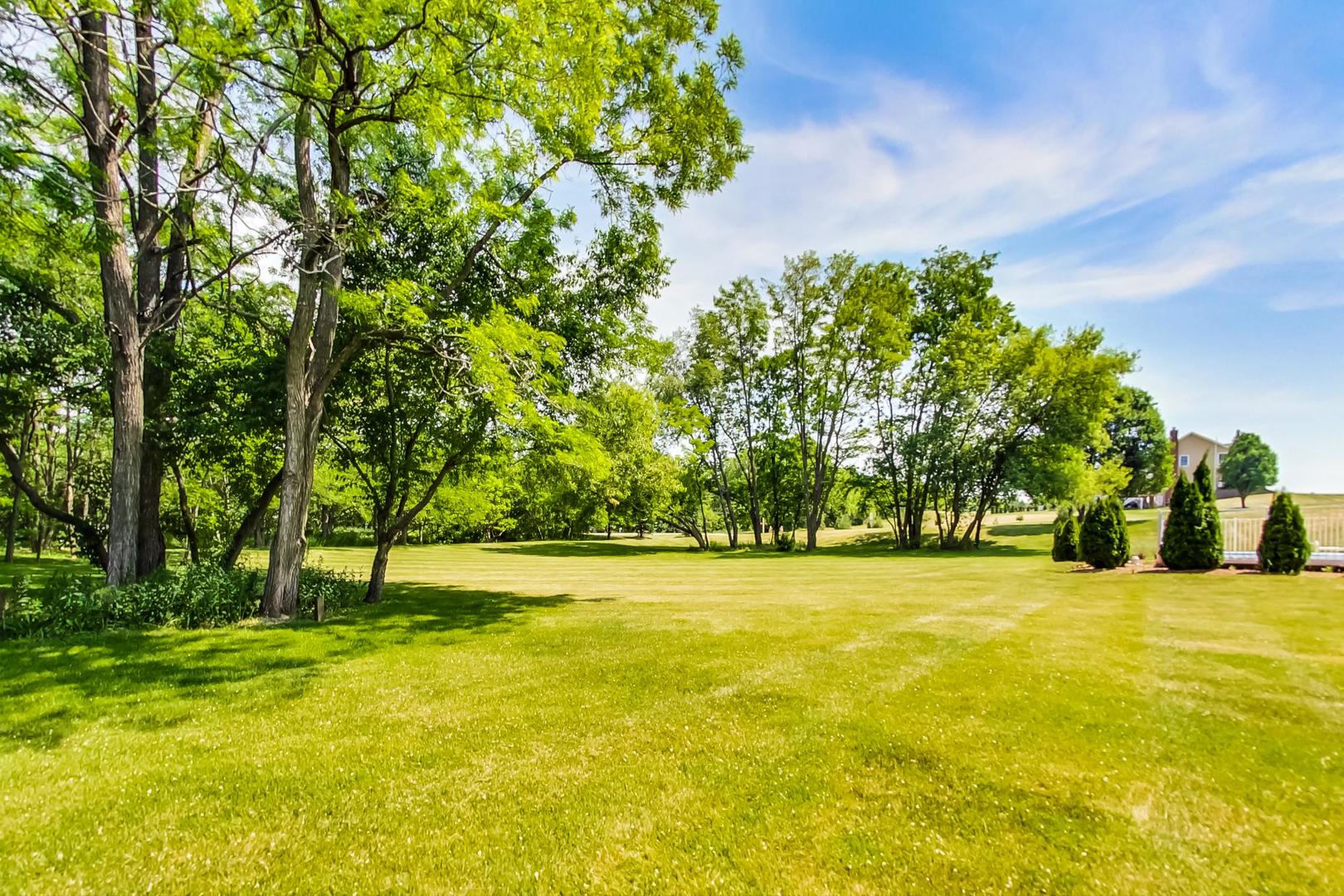 2101 Bull Ridge Drive McHenry, IL 60050 - Photo 80 of 83 a view of swimming pool with an outdoor space and seating area