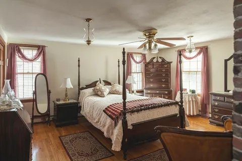 a view of livingroom with furniture and a fireplace