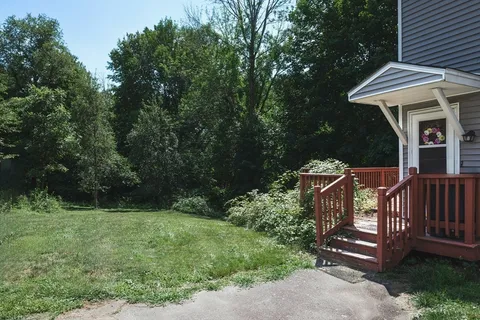 a view of a house with a tree