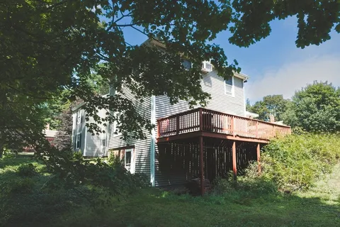 a backyard of a house with lots of green space