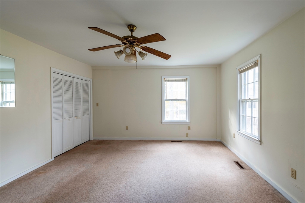 21-23 East Main Street Merrimac, MA 01860 - Photo 5 of 31 a view of room with chandelier fan and windows