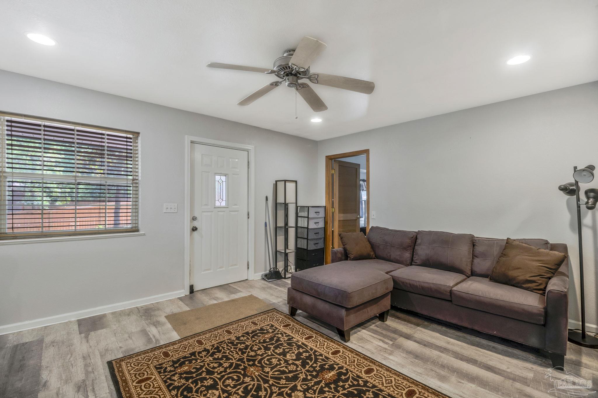 10290 West Lake Road Milton, FL 32583 - Photo 8 of 53 a living room with furniture and a window