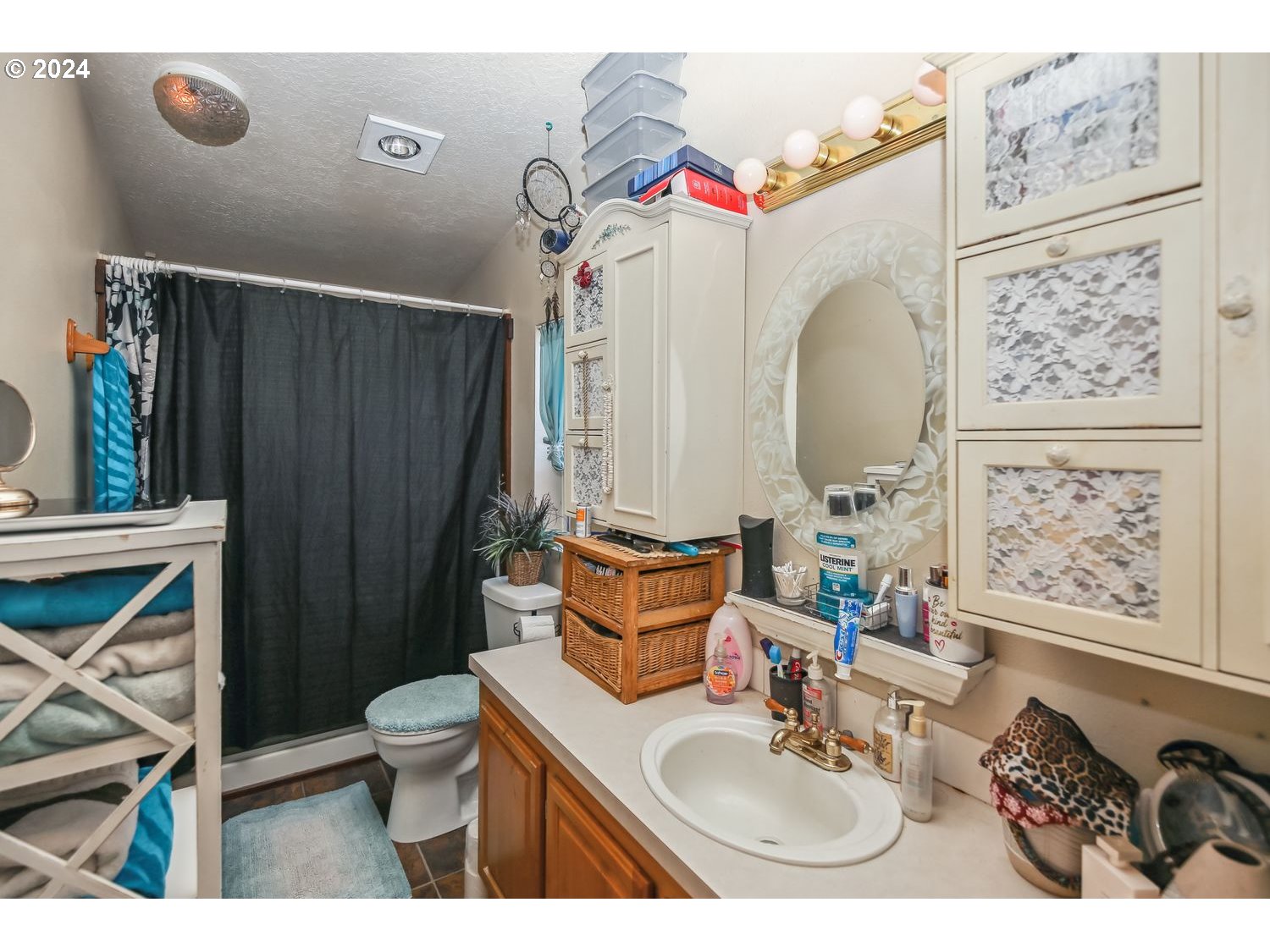 327 54th Street Springfield, OR 97478 - Photo 13 of 18 a bathroom with a sink vanity mirror and toilet