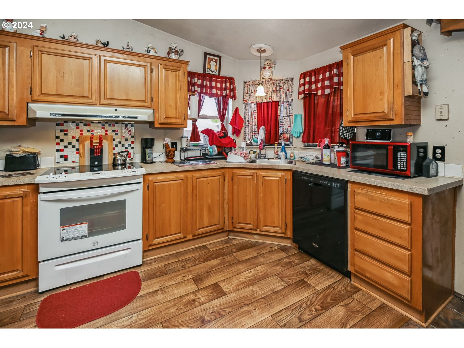327 54th Street Springfield, OR 97478 - Photo 8 of 18 a kitchen with stainless steel appliances granite countertop a stove cabinets and a sink