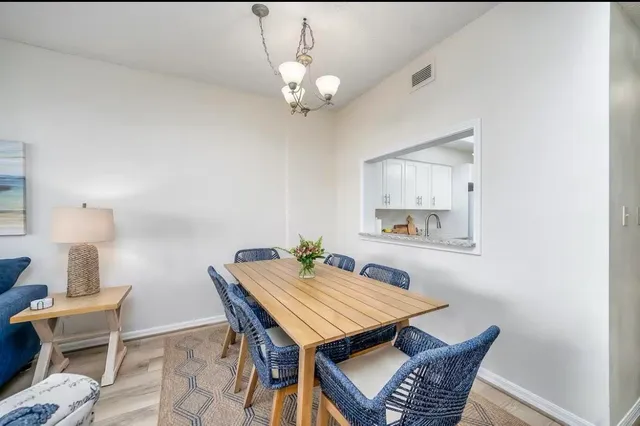 a dining room with a table and chairs