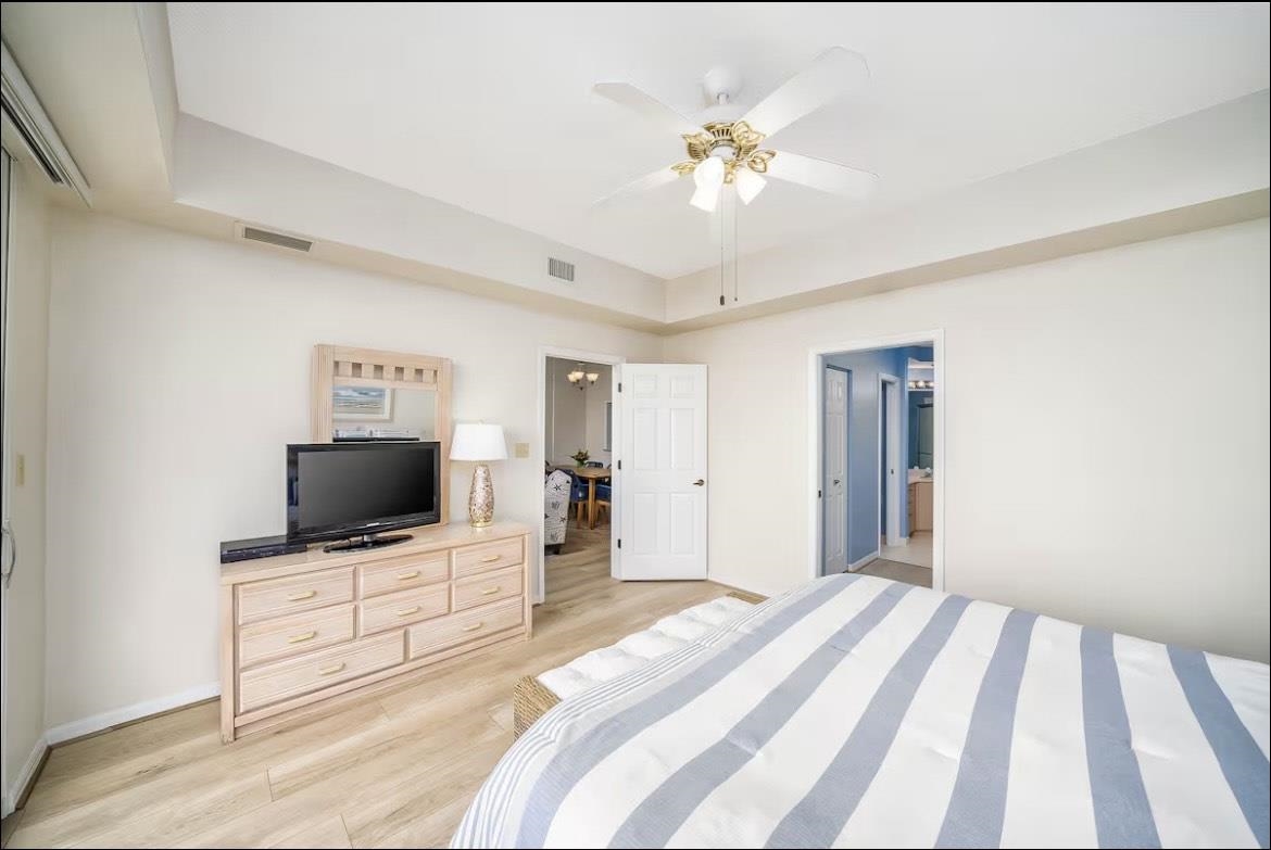 104 Surfview Drive, Unit 1307 Palm Coast, FL 32137 - Photo 7 of 17 a bedroom with a bed and a flat screen tv