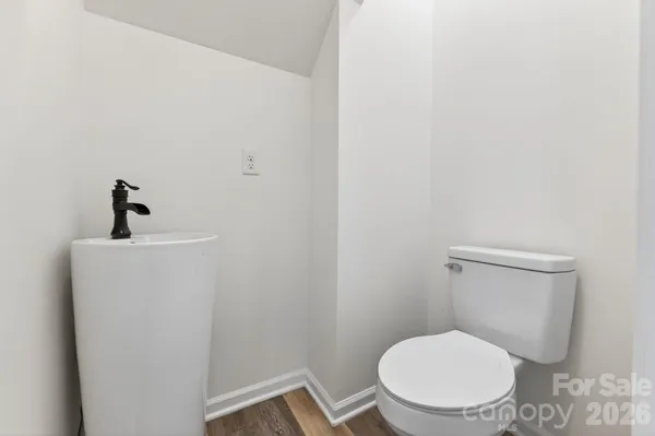 an empty room with window and a ceiling fan