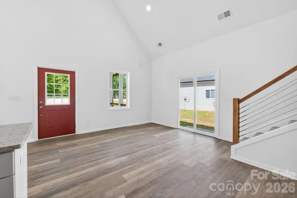 a view of room with window and hardwood floor