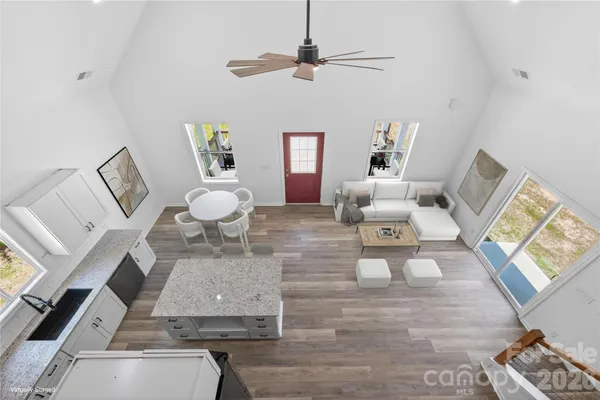 a kitchen with granite countertop cabinets stainless steel appliances and a counter space