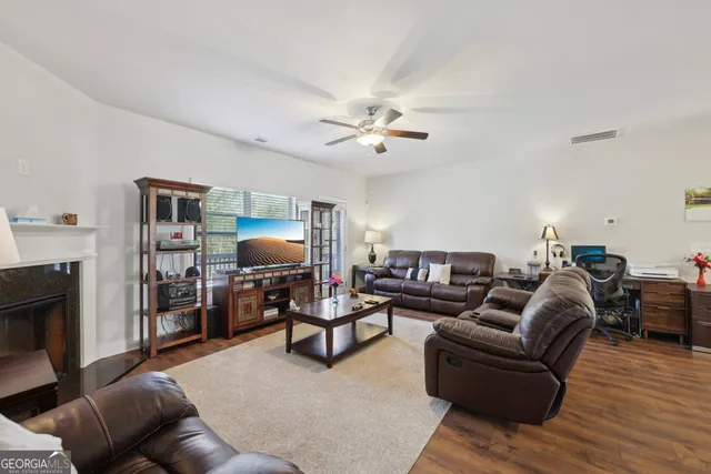 a living room with furniture and a fireplace