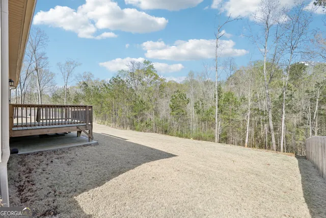 a view of a backyard with sitting area