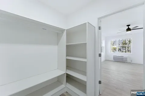 a view of an empty walk in closet