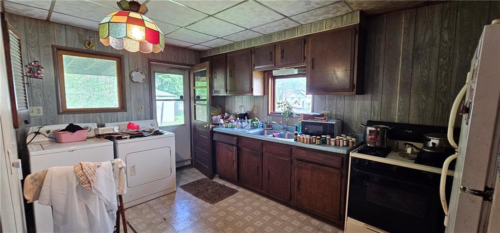 417 Uber Street New Castle, PA 16101 - Photo 13 of 43 a kitchen with a sink stove and cabinets