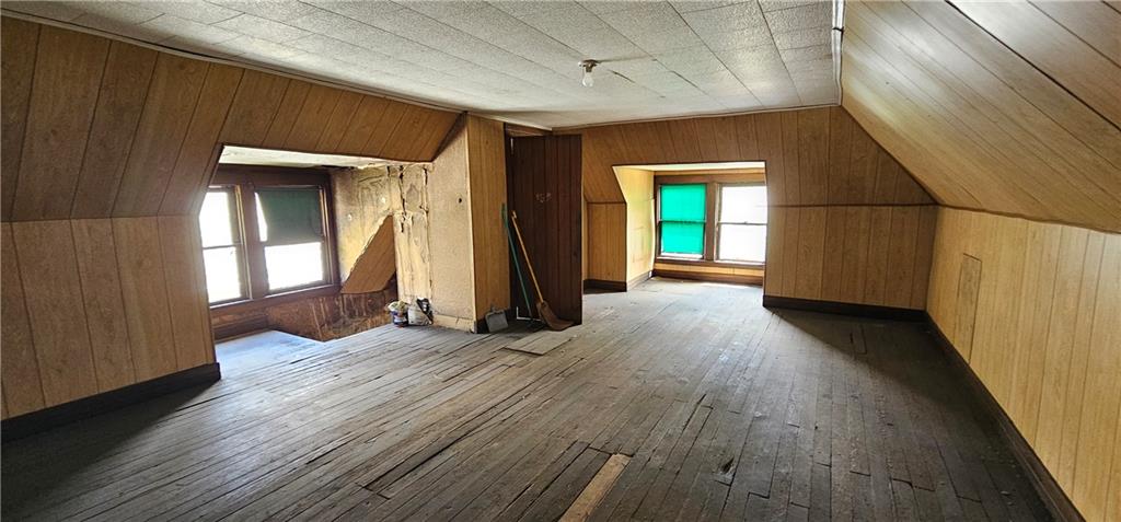 417 Uber Street New Castle, PA 16101 - Photo 28 of 43 an empty room with wooden floor and windows
