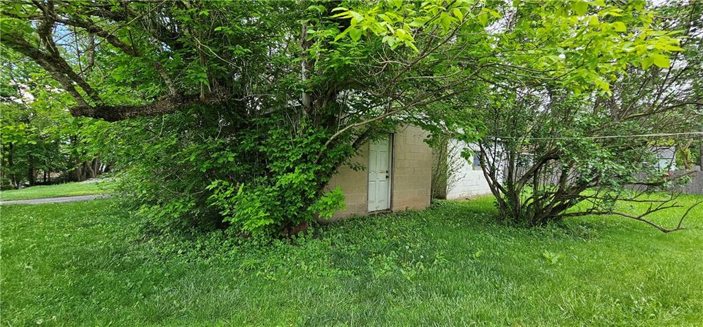 417 Uber Street New Castle, PA 16101 - Photo 38 of 43 a backyard of a house with lots of green space