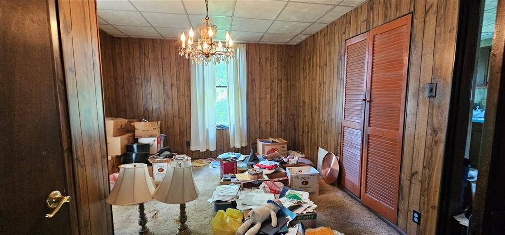 417 Uber Street New Castle, PA 16101 - Photo 8 of 43 a room with furniture and a chandelier