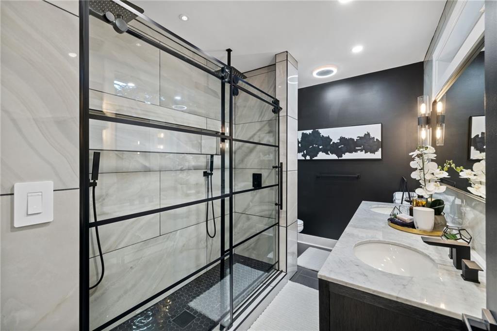 1112 James Street Pittsburgh, PA 15212 - Photo 12 of 26 a bathroom with a sink and mirror