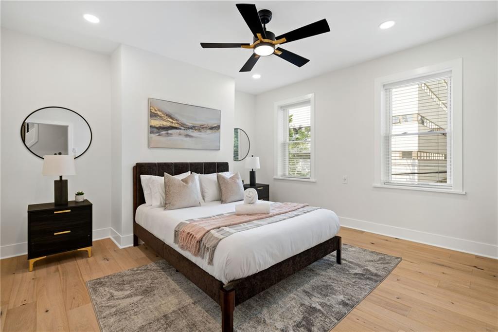 1112 James Street Pittsburgh, PA 15212 - Photo 15 of 26 a bedroom with a bed mirror and a window
