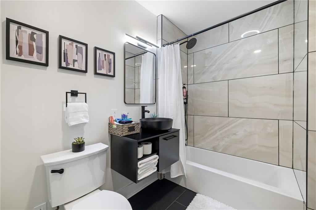 1112 James Street Pittsburgh, PA 15212 - Photo 17 of 26 a bathroom with a sink toilet and shower