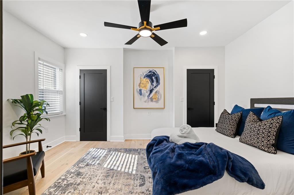 1112 James Street Pittsburgh, PA 15212 - Photo 20 of 26 a bedroom with a bed and a chandelier