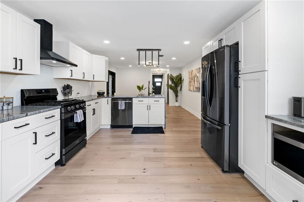 1112 James Street Pittsburgh, PA 15212 - Photo 2 of 26 a kitchen with stainless steel appliances a refrigerator sink and cabinets