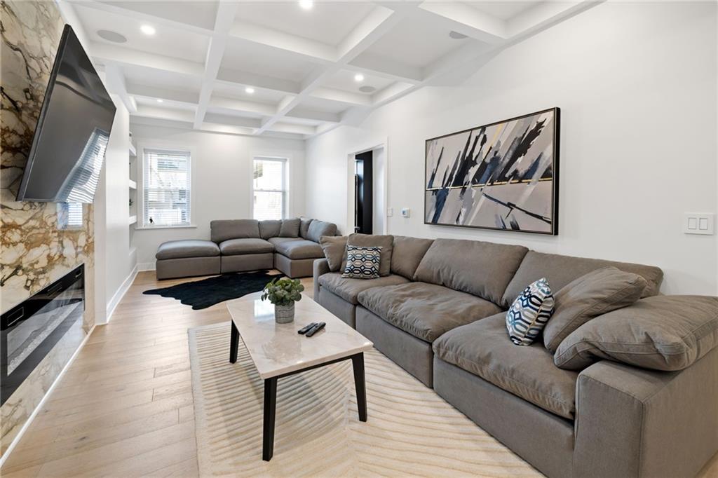1112 James Street Pittsburgh, PA 15212 - Photo 4 of 26 a living room with furniture and a flat screen tv