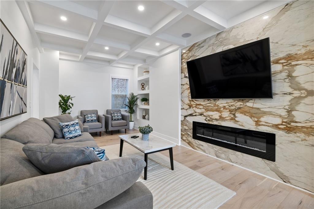 1112 James Street Pittsburgh, PA 15212 - Photo 5 of 26 a living room with furniture and a flat screen tv