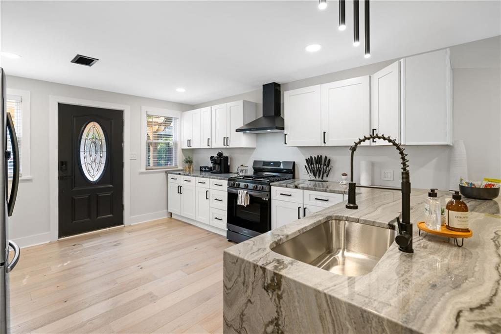 1112 James Street Pittsburgh, PA 15212 - Photo 6 of 26 a kitchen with a refrigerator sink and cabinets