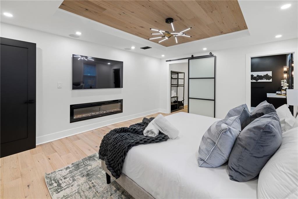 1112 James Street Pittsburgh, PA 15212 - Photo 9 of 26 a bedroom with a bed and a flat screen tv