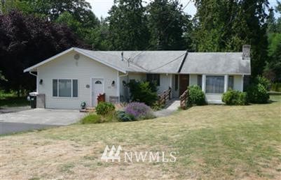263 Jericho Avenue Northeast Renton, WA 98059 - Photo 1 of 1 a front view of a house with garden