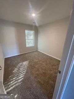 a bathroom with a tub sink and a mirror