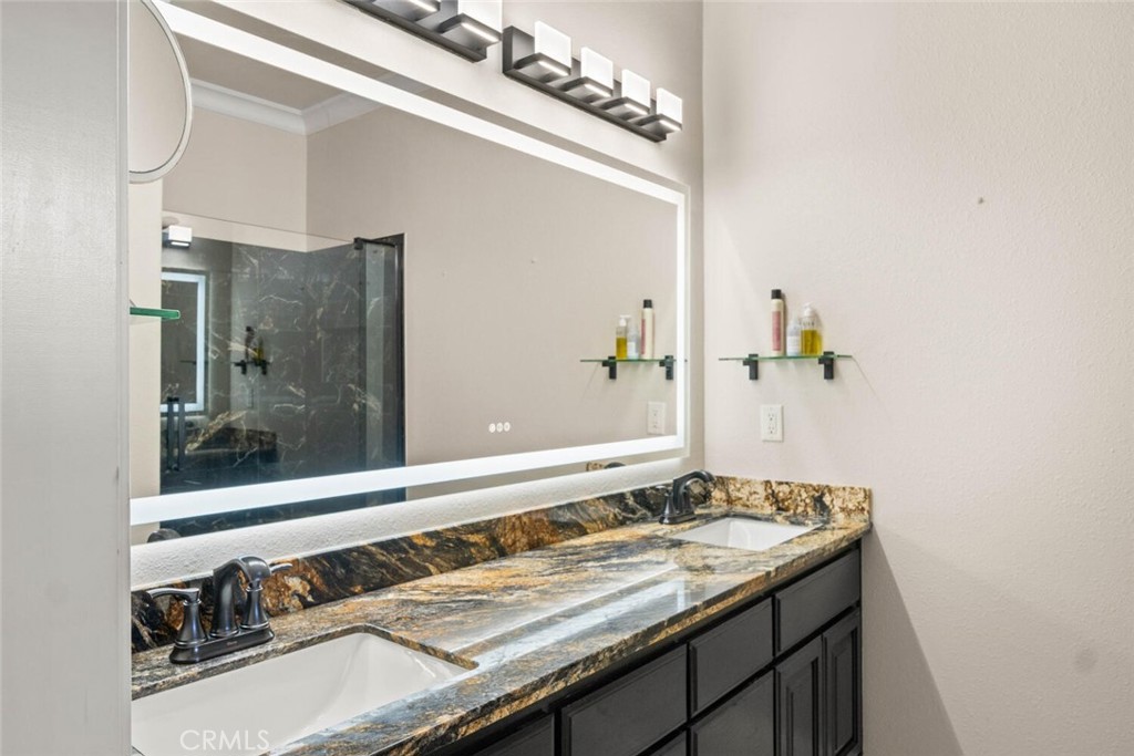 12138 Centerville Road Chico, CA 95928 - Photo 21 of 53 Updated granite counter with double sink and defrosting mirror